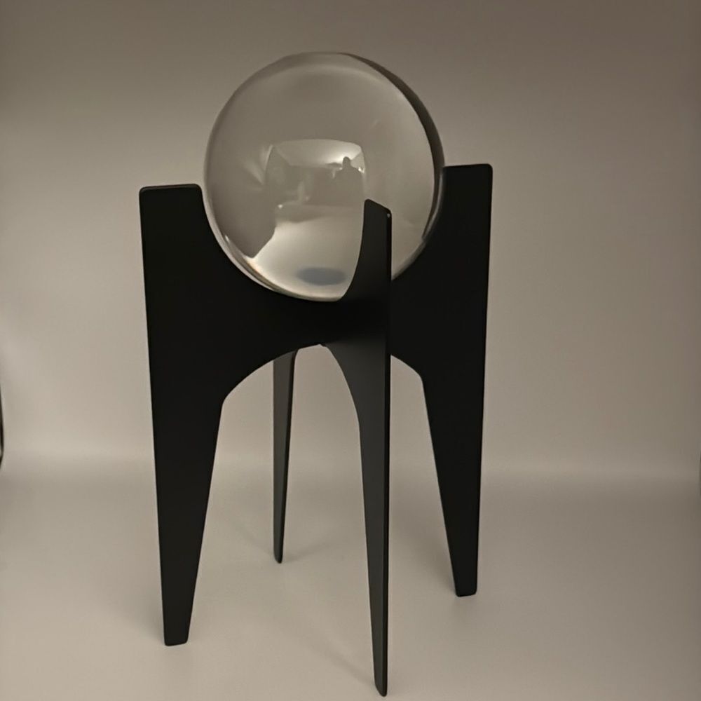 Crystal Sphere Elevated On Iron Bases Finished In A Brushed Black
